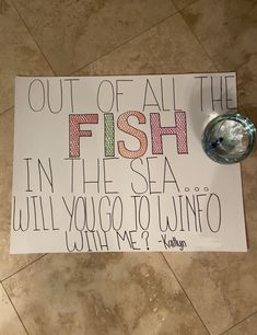 a sign on the floor that says out of all the fish in the sea will you go to wine?