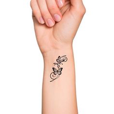 a woman's arm with a butterfly tattoo on it