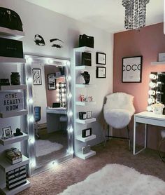 a room that has some lights on the walls and shelves in it, with a chair