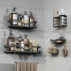 two black shelves with soap, lotion and other bathroom items on them in a bathroom