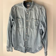 Unworn, Washed Once. Perfect Condition Blue Chambray Shirt With Classic 2 Pocket Style. Gap Blue Relaxed Fit Shirt, Gap Blue Shirt Relaxed Fit, Blue Relaxed Fit Shirt By Gap, Blue Relaxed Fit Gap Shirt, Blue Cotton Gap Shirt, Gap Light Blue Cotton Tops, Gap Blue Long Sleeve Shirt, Blue Long Sleeve Gap Shirt, Casual Denim Tops From Gap