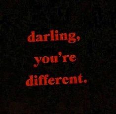 the words darling, you're different are lit up in red on a black background