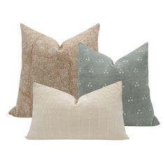 three pillows in different colors and patterns