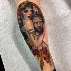 a man and woman tattoo on the arm