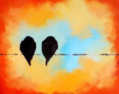 two birds are sitting on a wire against an orange and blue sky with yellow clouds