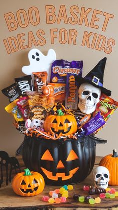 a halloween basket filled with candy, candies and other treats on a table next to a sign that says booo basket ideas for kids