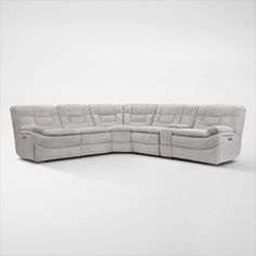 a large sectional sofa with two recliners on the back and one arm extended