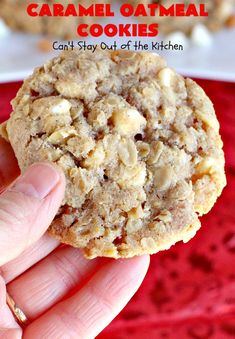 a person holding up a cookie in front of a plate with cookies on it and the words, caramel oatmeal cookies can't stay out of the kitchen