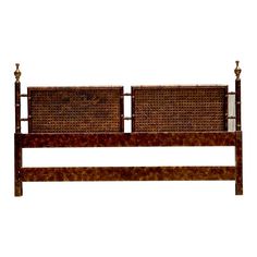 a bed frame with two headboards made out of wood and rattan, against a white background