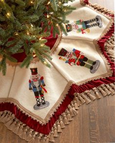 a christmas tree skirt with nutcrackers on it