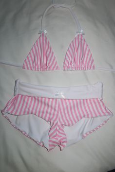 Your new favorite swim shorts are here.. <3 Low to mid rise fit white lining white bow detailing pink pinstripe pattern Styling & Fit Model wearing a size S Pair with the Candy Land Triangle Top for a complete look Fabric Nylon Spandex blend and lined Aftercare Hand wash in cold water and lay flat to dry Thank you for supporting my small business xx Caity Burdash Pink Pinstripe, Handmade Swimwear, Pinstripe Pattern, Swim Short, Cute Bathing Suits, Cute Swimsuits, Summer Swim Suits, Summer Set, Swim Skirt