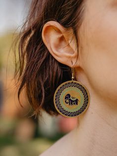 Elephants are considered an emblem of good fortune around the world. Wear these adorable elephant earrings on a big day for a boost of good luck or just for fun! Hand painted color and goldtone-plated brass 2.5" length Made fair trade in India by one of our longstanding production partners Paint Brass, Elephant Earrings, Hand Painted Earrings, Elephant Painting, Indian Elephant, Painted Jewelry, Evil Eye Earrings, Hand Painted Jewelry, Evil Eye Ring