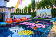 an image of a pool decorated with balloons and streamers in the shape of letters