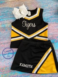 two piece cheer uniform with white bow and name on it