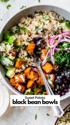 a bowl filled with rice, beans and veggies