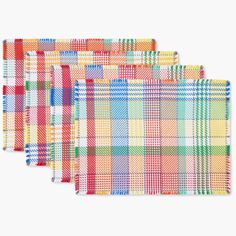 four plaid placemats in different colors