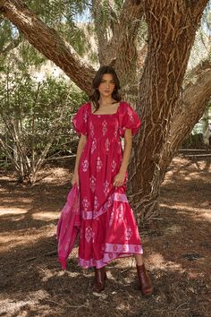 Pretty in pink! The Mercer Floral Berky Smocked Maxi Dress gives us two tones of pink. It features short bubble sleeves, a square neckline, and with a front and back smocked bodice. It has a loose fit with a tier in the bottom. Keep the look fun with pops of colored accessories and shoes.- Smocked- Short bubble sleeve- Square neck- Floral- Color: BerrySize + Fit - Model is 5'9" and wearing size XS- Measurements taken from size S - Chest: 14"- Length: 48 3/4" Fabric Self: 100% Cotton, Lining: 100 Milkmaid Gown, Fushia Dresses, Maxi Dress Modest, Floral Puff Sleeve Dress, Smocked Maxi Dress, Short Sleeve Maxi Dress, Bra Dress, Short Sleeve Maxi Dresses, Dress With Sleeves