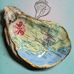 a shell shaped dish with a map on it