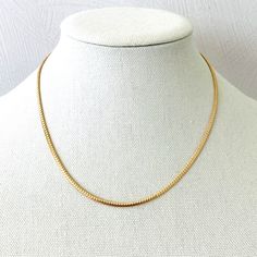 A gorgeous flat snake chain necklace in rich yellow gold fill. The chain is 3mm wide by 1.2mm deep. It looks just like solid gold.The chain can be worn by itself, with a pendant, or in a necklace stack. The condition is excellent, unworn. Flat Snake Chain Necklace Gold, Yellow Gold Plated Snake Chain Necklace, Minimalist Gold-plated Yellow Gold Snake Chain Necklace, Adjustable Gold-plated Snake Chain Necklace, Gold-tone Metal Snake Chain Necklace, Flat Snake Chain, Necklace Stack, Snake Chain Necklace, Snake Chain