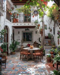 an outdoor dining area with potted plants