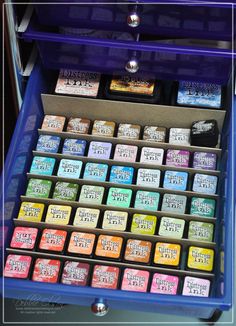 an assortment of different colored powders in a blue case