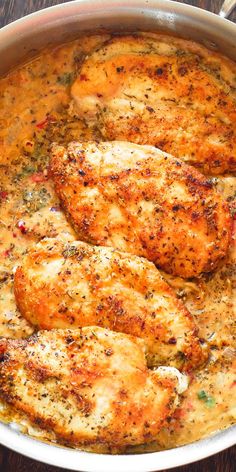 some chicken is cooking in a pan on the table and ready to be eaten by someone