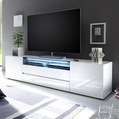 a living room with a white entertainment center