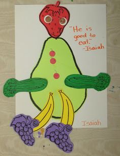 a drawing of a fruit and vegetable character on a piece of paper with grapes, tomatoes, and an apple