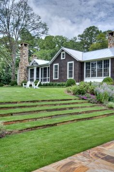 a house with steps leading to the front yard