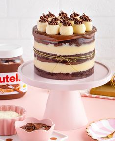 there is a cake with chocolate and marshmallows on it, along with other desserts