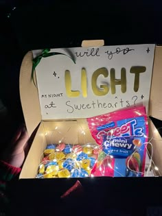 an open box with candy and lights in it that says, well go light at sweethearts?