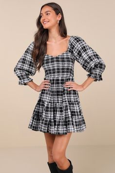 There's no competition when it comes to you in the Lulus No One Cuter Black and Ivory Plaid Puff Sleeve Tiered Mini Dress! This fall-ready dress has a medium-weight, woven rayon construction (with a plaid pattern throughout) that shapes a V-neckline framed by three-quarter puff sleeves with elastic at the shoulders and ruffle cuffs. A smocked bodice tops an empire waist and a tiered mini skirt. Perfect for pairing with your fave boots for an extra cute 'fit! Fit: This garment fits true to size. Length: Mid-thigh. Size medium measures 33.5" from shoulder to hem. Bust: Great for any cup size. Waist: Fitted - elastic waist allows stretch. Hip: Not Fitted - fuller skirt allows room for hips. Undergarments: May be worn with any standard bra. Fabric: Fabric has no stretch. Unlined. 80% Polyester Tiered Mini Skirt, Bodice Top, Cute Fit, Tartan Dress, Plaid Dress, Large Size Dresses, Three Quarter Sleeves, Empire Waist, Cute Black