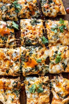 several slices of pizza with cheese and herbs