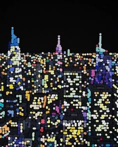 the city is lit up at night with lots of dots on it's surface