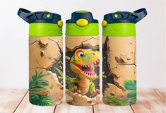 two children's water bottles with dinosaurs on them