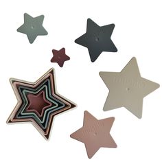 three star shaped magnets with the word musing on them in different colors and shapes