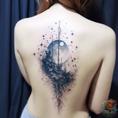 the back of a woman's body with a ship and moon tattoo on it