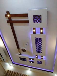 an overhead view of a living room with lights on the ceiling and decorative lighting above it