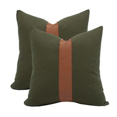 two green and brown pillows with leather trims on each pillow, one in the shape of a rectangle