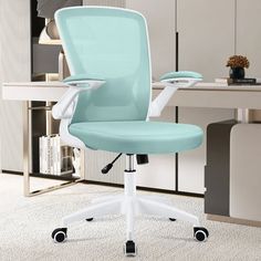 a light blue office chair sitting on top of a white carpeted floor next to a desk