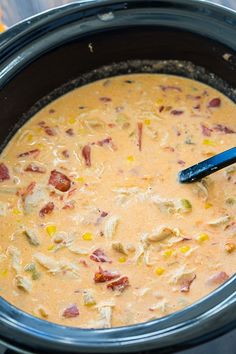 a crock pot filled with corn and bacon soup