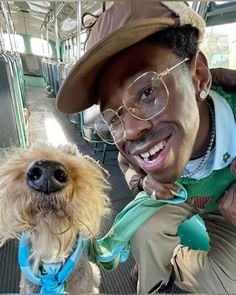 a man and his dog on a bus