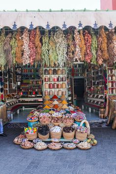 an outdoor market with lots of food on display