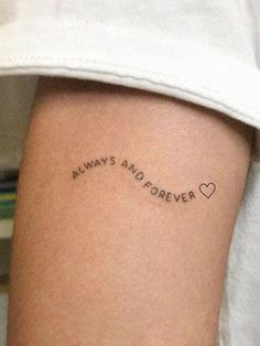 a woman's arm with the words always and forever tattooed on her left side