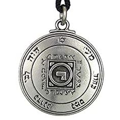 a silver medallion with the seal of solomon on it's side and an inscription in hebrew