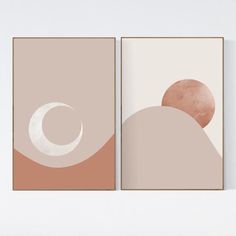 two abstract paintings on the wall, one with a half moon