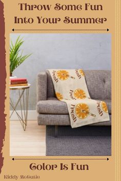 a couch sitting in front of a wall with an orange print on it and the words throw some fun into your summer