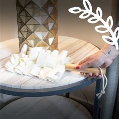 a woman is cutting up some food on a table