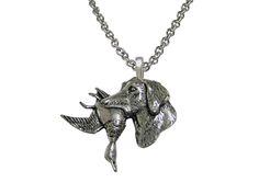 a silver necklace with an elephant head on it's face and two horns hanging from the neck