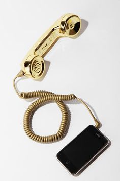 an old style phone is connected to a cord